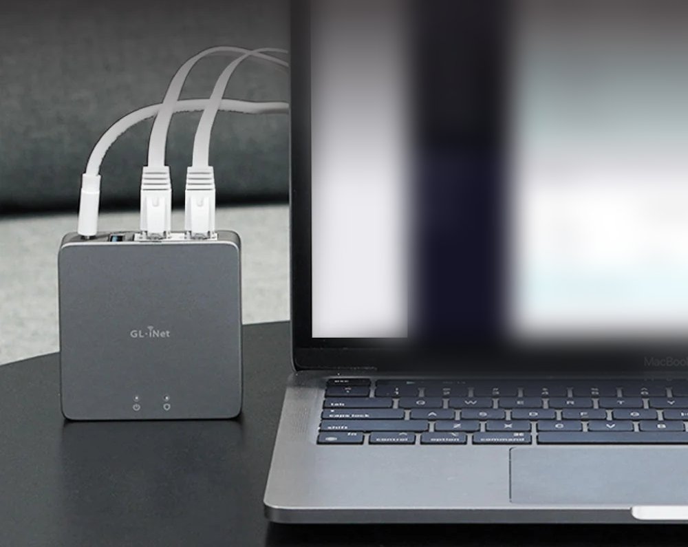 The DroTiser firewall box connected beside a laptop